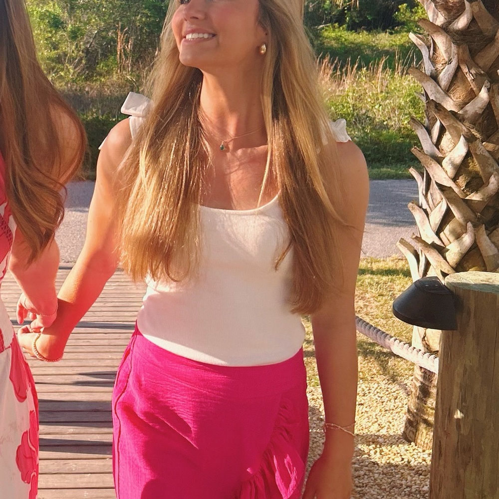 White body suit that ties with bows